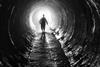 Man-Walking-Dark-Tunnel-Main_article_image.jpg