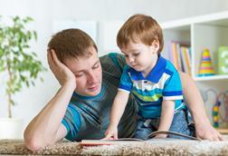 Dad reading with child
