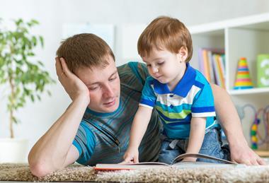 Dad reading with child