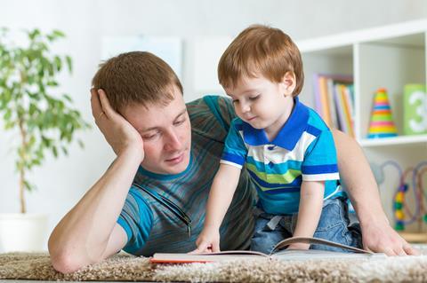 Dad reading with child